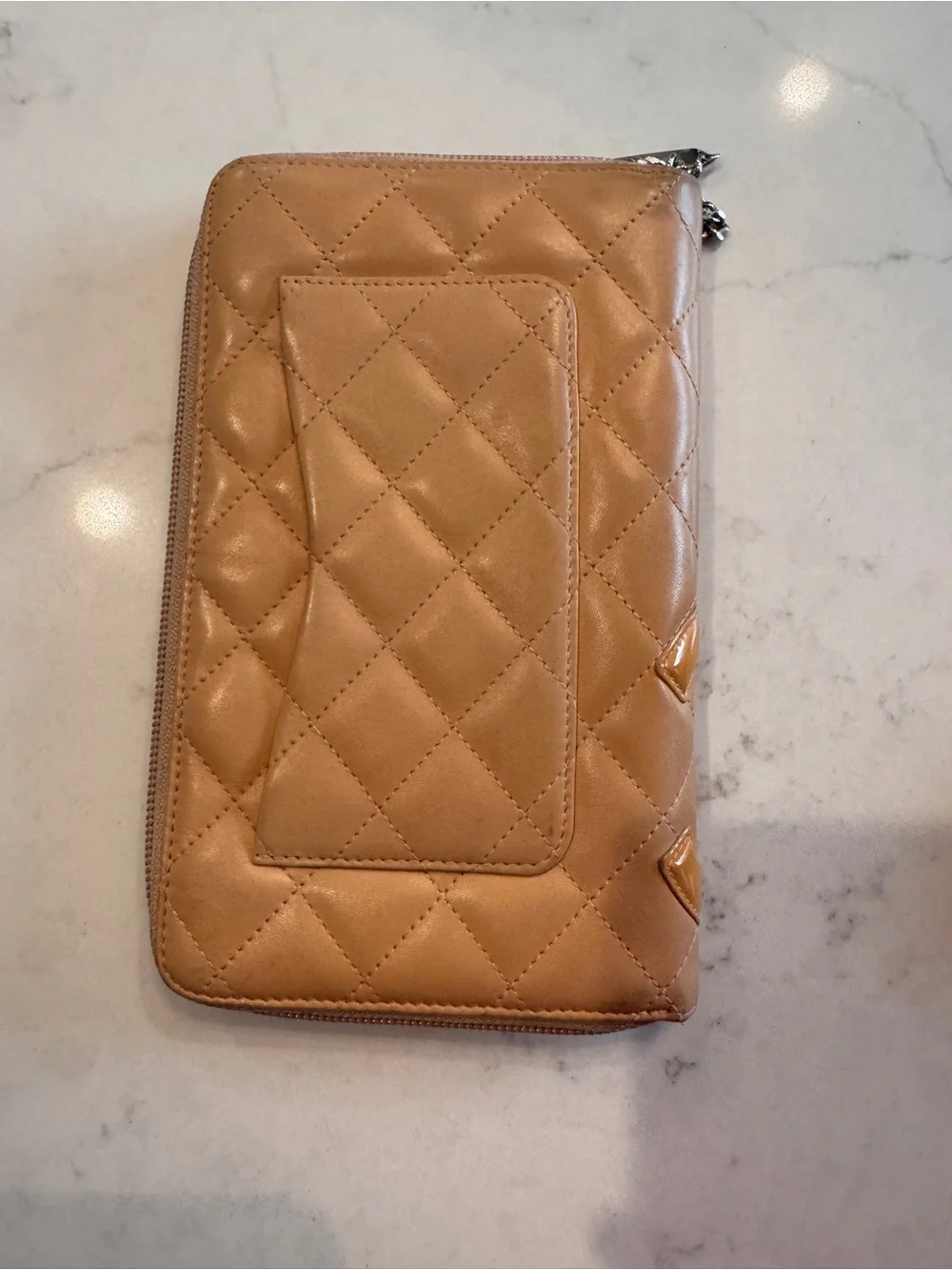 CHANEL Quilted Zip Phone Wallet in Tan with Yellow CC Logo